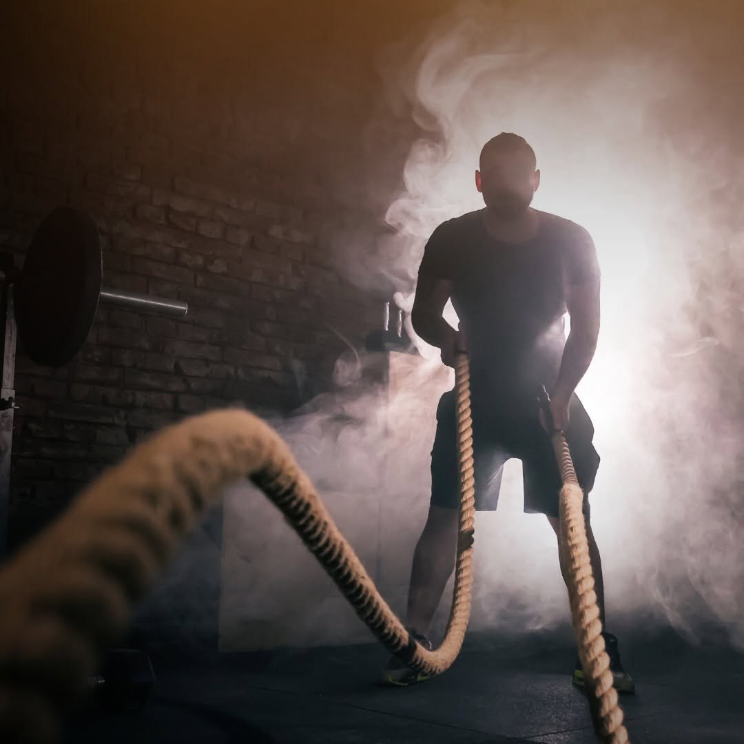 Man training with battle ropes